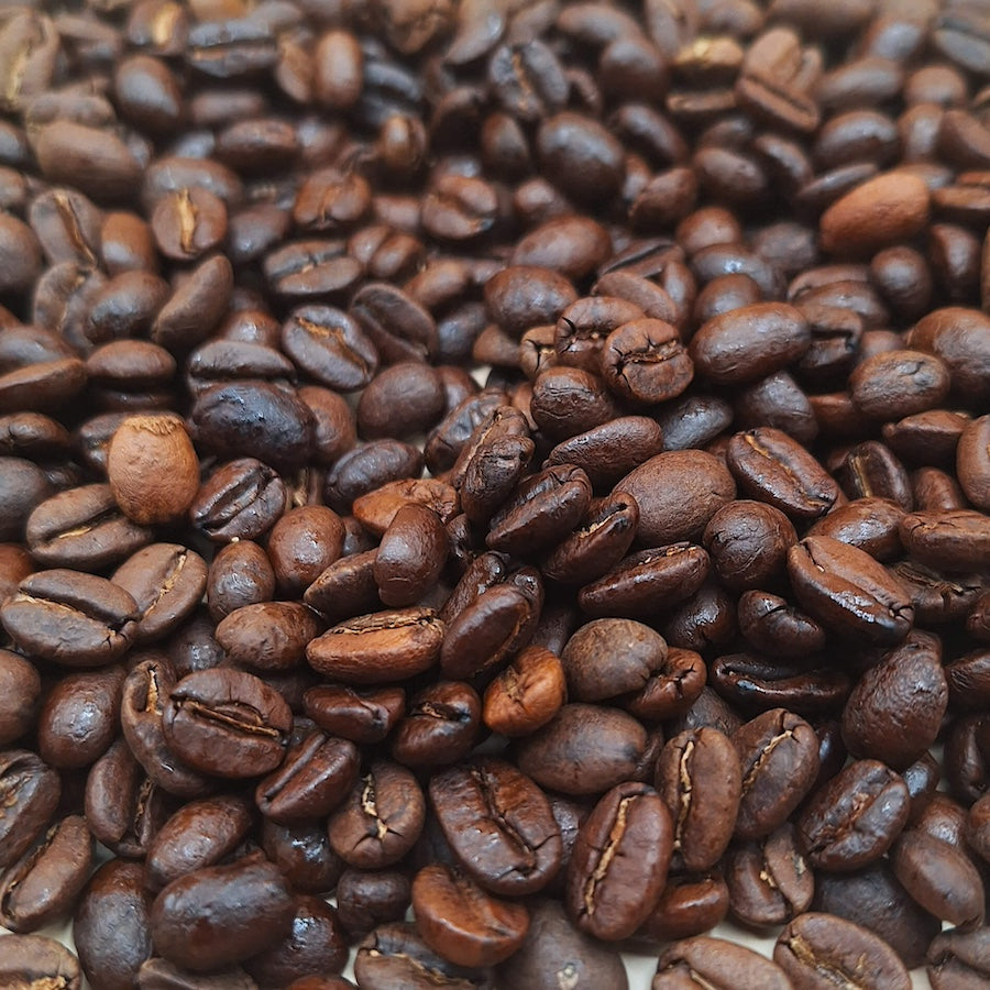 A coffee blend, featuring both light and dark beans.