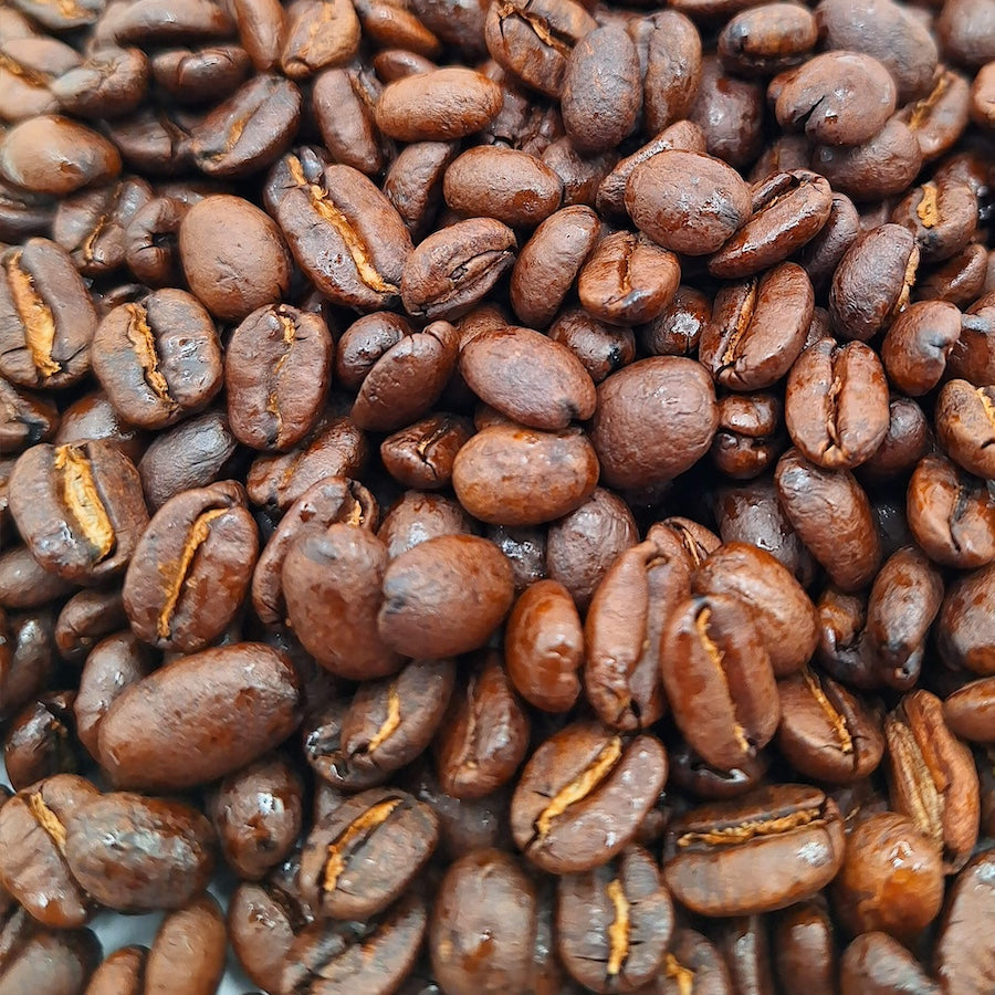 A macro shot of medium roasted whole arabica coffee beans.